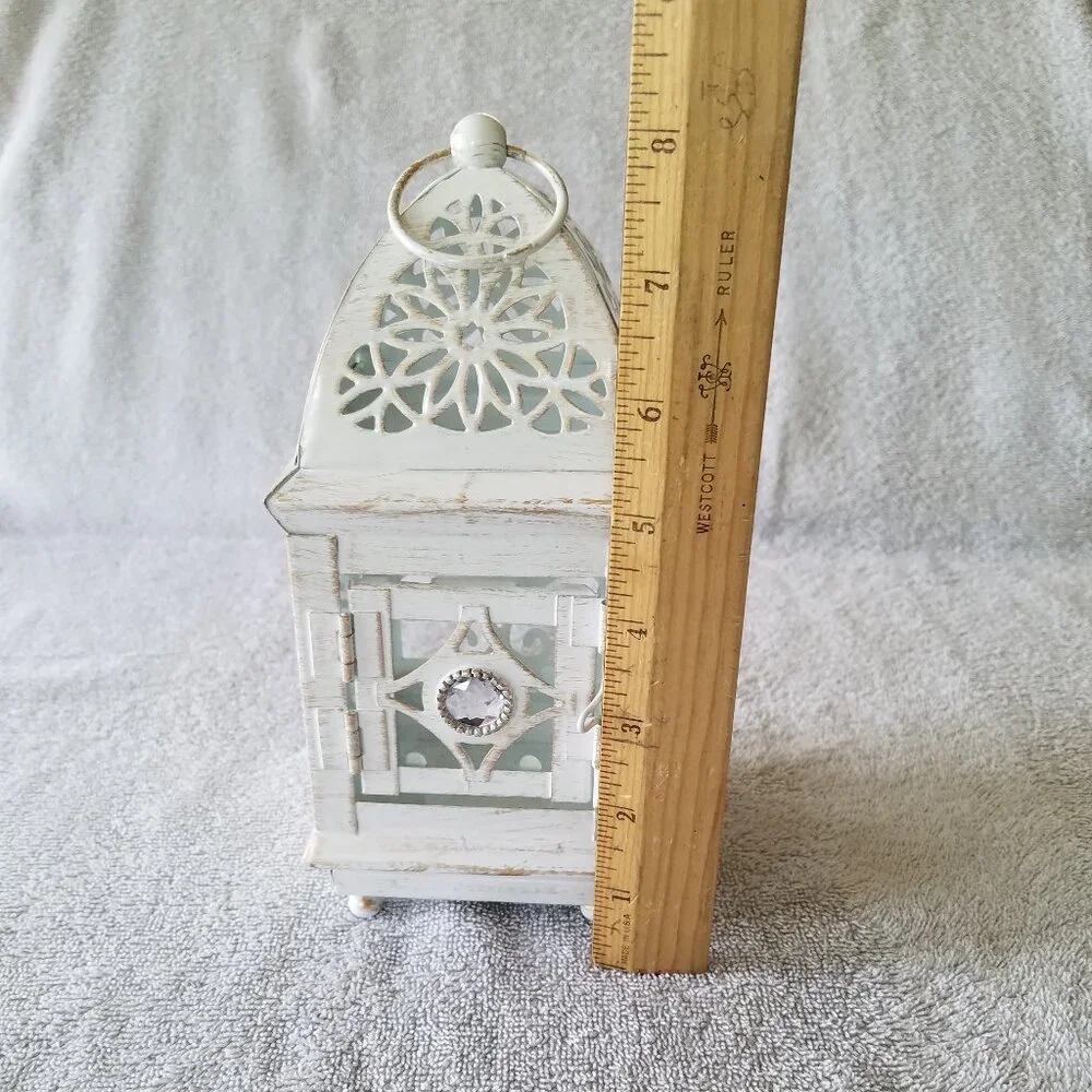 ASHLAND'S ELEGANT ANTIQUE LANTERN IN OFF WHITE WITH DISTRESSED DESIGN IN METAL
